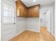 Additional dining space featuring hardwood floors, gray walls, and wooden cabinets at 209 Brailsford Rd, Summerville, SC 29485