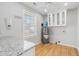 Bright laundry room features white cabinets, granite countertops, window and a water heater at 209 Brailsford Rd, Summerville, SC 29485