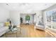 Bright living room with hardwood floors and a view to the dining area and backyard at 209 Brailsford Rd, Summerville, SC 29485