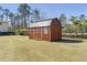Outdoor shed with red walls and metal roof at 209 Brailsford Rd, Summerville, SC 29485