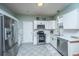 Modern kitchen featuring stainless steel appliances, white cabinets, and subway tile backsplash at 211 Trestlewood Dr, Summerville, SC 29486