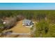 Aerial view of a home surrounded by lush greenery, showcasing its serene and private setting at 214 Shelby Shea Ln, Moncks Corner, SC 29461