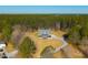 Stunning aerial view of a beautiful single-Gathering home surrounded by lush greenery and a long driveway at 214 Shelby Shea Ln, Moncks Corner, SC 29461