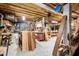Spacious unfinished basement providing ample storage and utility space with tools and work bench at 214 Shelby Shea Ln, Moncks Corner, SC 29461