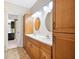 Bathroom features a double vanity with wood cabinets and large mirrors at 214 Shelby Shea Ln, Moncks Corner, SC 29461