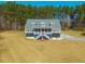 Charming two-story home with landscaped yard and welcoming front porch nestled in a wooded lot at 214 Shelby Shea Ln, Moncks Corner, SC 29461