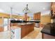 Open-concept kitchen with a central island and modern appliances, seamlessly connecting to the dining and living areas at 214 Shelby Shea Ln, Moncks Corner, SC 29461