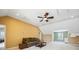Spacious bonus room featuring a ceiling fan, comfortable seating, and ample natural light from a window view at 214 Shelby Shea Ln, Moncks Corner, SC 29461