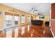 Bright living room with hardwood floors and doors leading to a deck, seamlessly blending indoor and outdoor spaces at 214 Shelby Shea Ln, Moncks Corner, SC 29461