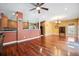 Open living space with a kitchen view, hardwood floors, and a dining area under a chandelier at 214 Shelby Shea Ln, Moncks Corner, SC 29461