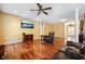 Spacious living room with hardwood floors and a ceiling fan, perfect for entertaining guests at 214 Shelby Shea Ln, Moncks Corner, SC 29461