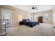 Spacious main bedroom with neutral carpet, ceiling fan, and access to an outdoor deck through a glass door at 214 Shelby Shea Ln, Moncks Corner, SC 29461