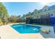 Backyard view featuring an in-ground swimming pool surrounded by a concrete patio at 214 Shelby Shea Ln, Moncks Corner, SC 29461