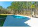 Backyard features a large in-ground pool surrounded by tall trees at 214 Shelby Shea Ln, Moncks Corner, SC 29461