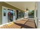 Welcoming front porch with a ceiling fan, offering a relaxed space to enjoy the outdoor scenery at 214 Shelby Shea Ln, Moncks Corner, SC 29461