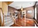 Stairway with natural light, wood railing, with an open view to the lower level at 214 Shelby Shea Ln, Moncks Corner, SC 29461
