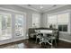 Cozy breakfast nook with bench seating, table, and natural light from the windows at 2333 Town Woods Rd, Charleston, SC 29414