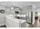 Contemporary kitchen with gray cabinets, pendant lighting, and stainless steel appliances at 2333 Town Woods Rd, Charleston, SC 29414