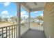 Spacious front porch with white railings and a view of the neighborhood at 2333 Town Woods Rd, Charleston, SC 29414