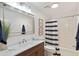 This well-lit bathroom offers modern fixtures and a stylish striped shower curtain at 236 Driftwood Ln, Edisto Island, SC 29438