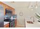 Updated kitchen with stainless steel appliances and light countertops and tile backsplash at 236 Driftwood Ln, Edisto Island, SC 29438