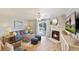 Cozy living room with fireplace, TV, comfortable seating, and access to the balcony at 236 Driftwood Ln, Edisto Island, SC 29438