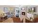 Inviting living room with fireplace, tv, comfortable seating, and access to the balcony at 236 Driftwood Ln, Edisto Island, SC 29438