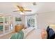 Relaxing main bedroom boasting a ceiling fan, balcony access, and ample closet space at 236 Driftwood Ln, Edisto Island, SC 29438