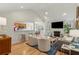 Bright living room with vaulted ceilings, a fireplace, hardwood floors, and an open floor plan at 2634 Lani Ct, Charleston, SC 29414