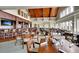 Spacious dining room featuring a bar, high ceilings, wood accents, and many windows for lots of natural light at 2774 Hidden Oak Dr, Seabrook Island, SC 29455