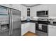 Modern kitchen featuring stainless steel appliances, white cabinetry, and sleek countertops at 2774 Hidden Oak Dr, Seabrook Island, SC 29455