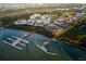 Aerial view of waterfront community featuring modern townhomes, marina access, and scenic coastal surroundings at 317 Longshore St # 317, Charleston, SC 29492
