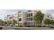 A charming multi-story townhome features balconies and black window frames, blending modern design with comfortable living at 317 Longshore St # 317, Charleston, SC 29492