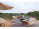 Rooftop deck, complete with comfortable outdoor seating and dining area, offers the perfect space for relaxation and entertainment at 317 Longshore St # 317, Charleston, SC 29492