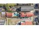 Aerial view of a property with a backyard pool, red roof, surrounding buildings, and landscape at 34 Percy St, Charleston, SC 29403