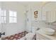 Bathroom featuring a glass door shower with brick-style tile and a modern vanity at 34 Percy St, Charleston, SC 29403
