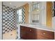 This bathroom showcases modern design with a glass enclosed shower, wood accents and sleek vanity at 34 Percy St, Charleston, SC 29403