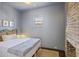Cozy bedroom featuring a brick fireplace and light-filled window at 34 Percy St, Charleston, SC 29403