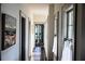 Hallway featuring hardwood floors, artwork, and plenty of natural light at 34 Percy St, Charleston, SC 29403
