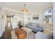 Bright open living room featuring modern furnishings and decor with view into the gourmet kitchen at 34 Percy St, Charleston, SC 29403