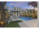 Stunning pool and backyard with palm trees at twilight at 34 Percy St, Charleston, SC 29403