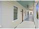 Exterior view of the porch showing the wood siding and ceiling fans at 34 Percy St, Charleston, SC 29403
