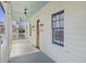 Covered front porch with ceiling fans and railing at 34 Percy St, Charleston, SC 29403