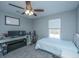 Bright bedroom with a ceiling fan, computer desk, and a comfortable twin bed near the window at 3405 Painswick Rd, Johns Island, SC 29455