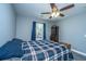 Inviting bedroom with a ceiling fan and a plaid comforter, creating a cozy retreat at 3405 Painswick Rd, Johns Island, SC 29455