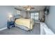 Serene bedroom with a queen bed, a window seat, and soft, neutral colors at 3405 Painswick Rd, Johns Island, SC 29455