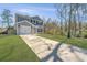 Lovely light blue two-story home with a well-manicured lawn, concrete driveway and a one-car attached garage at 3405 Painswick Rd, Johns Island, SC 29455