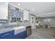 Open kitchen featuring a farmhouse sink, stylish cabinetry, and a view of the dining area at 3405 Painswick Rd, Johns Island, SC 29455
