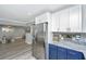 Spacious kitchen with stainless steel refrigerator, modern cabinetry, and granite countertops at 3405 Painswick Rd, Johns Island, SC 29455