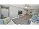 Open living room with neutral walls and flooring that flows into dining area and an inviting atmosphere at 3405 Painswick Rd, Johns Island, SC 29455